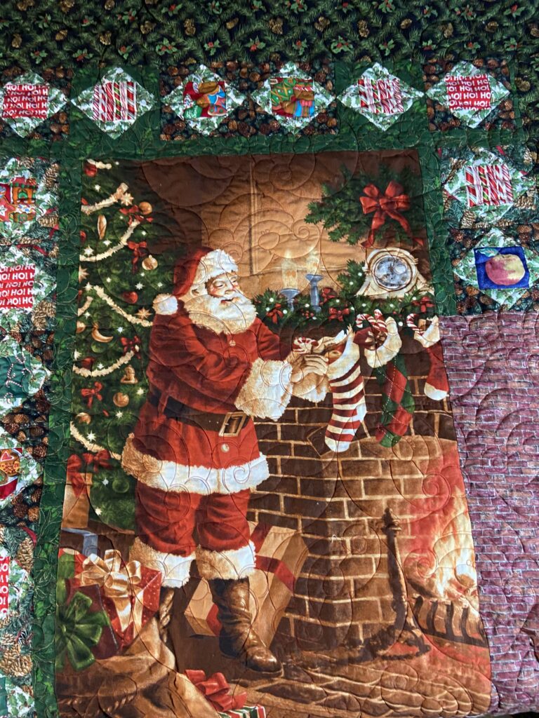 Santa Claus quilt I made and donated to charity in 2023.